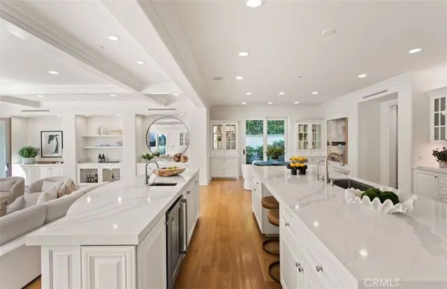 a living room with furniture fireplace and a large window