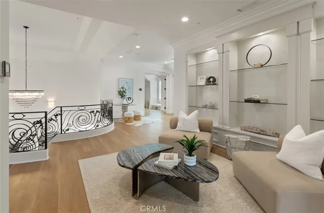 a bedroom with a bed lamps and wooden floor