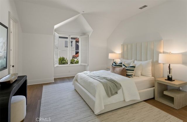 a bedroom with a bed and a table