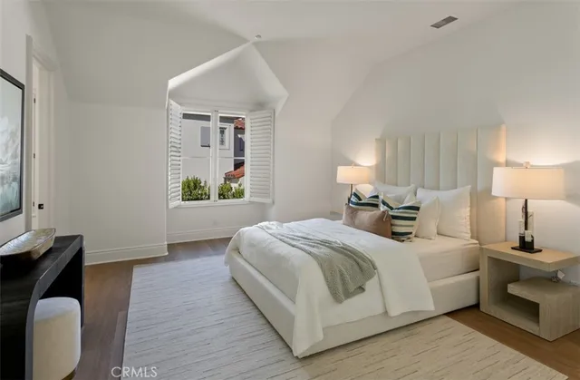 a bedroom with a bed and a table