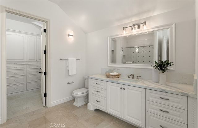 an aerial view of residential houses with outdoor space and swimming pool