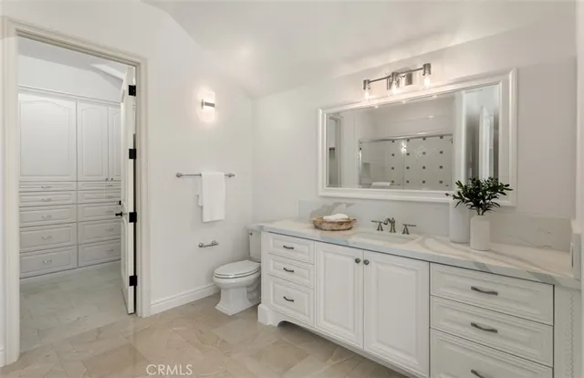 an aerial view of residential houses with outdoor space and swimming pool