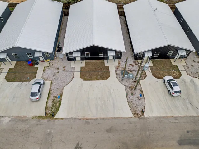 an aerial view of a city with lots of residential buildings