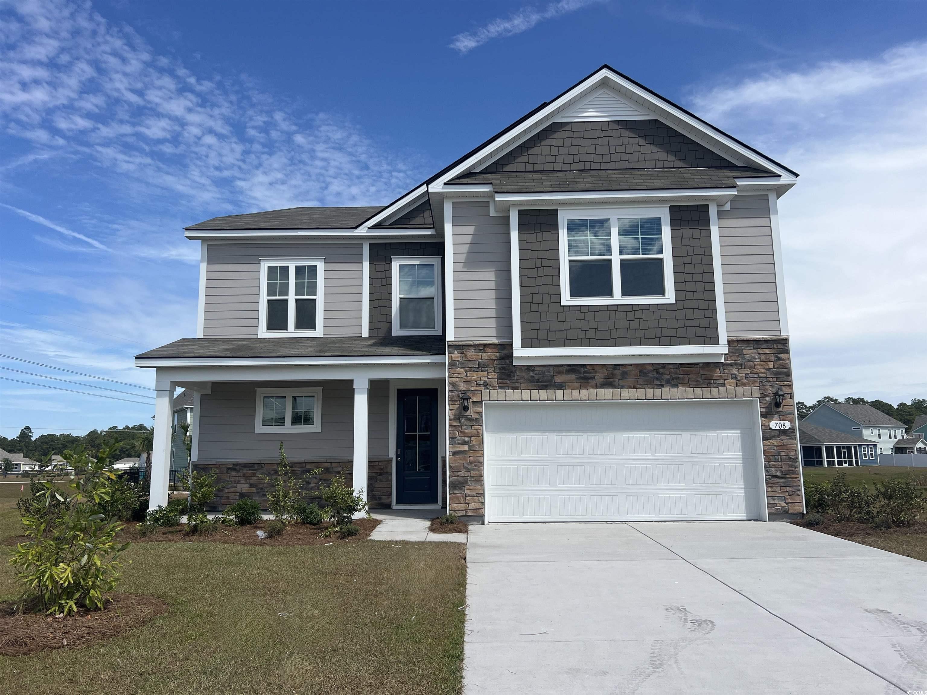 708 Rupert Drive Conway, SC 29526 - Photo 1 of 35 Craftsman-style house featuring stone siding, a porch, concrete driveway, a garage, and a front lawn