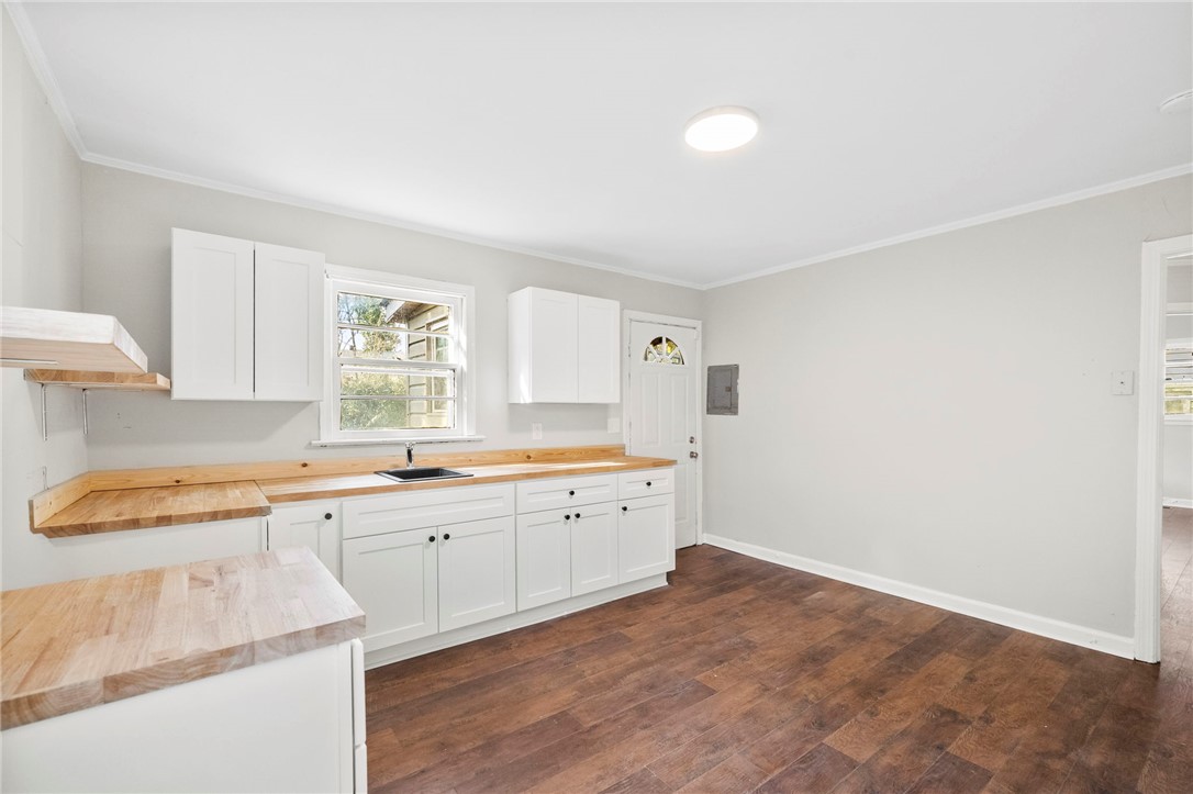 825 Dora Drive Anderson, SC 29624 - Photo 13 of 27 This spacious kitchen offers ample cabinetry and beautiful wooden countertops.