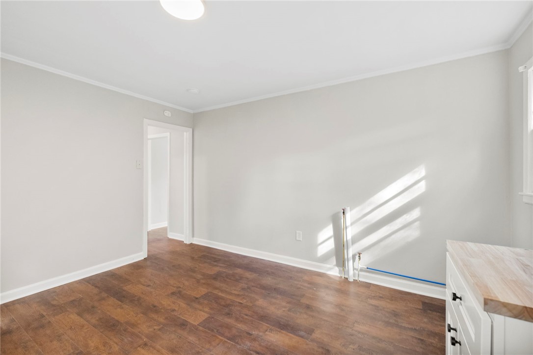825 Dora Drive Anderson, SC 29624 - Photo 14 of 27 This versatile room offers bright interiors and durable flooring, ideal for various uses.