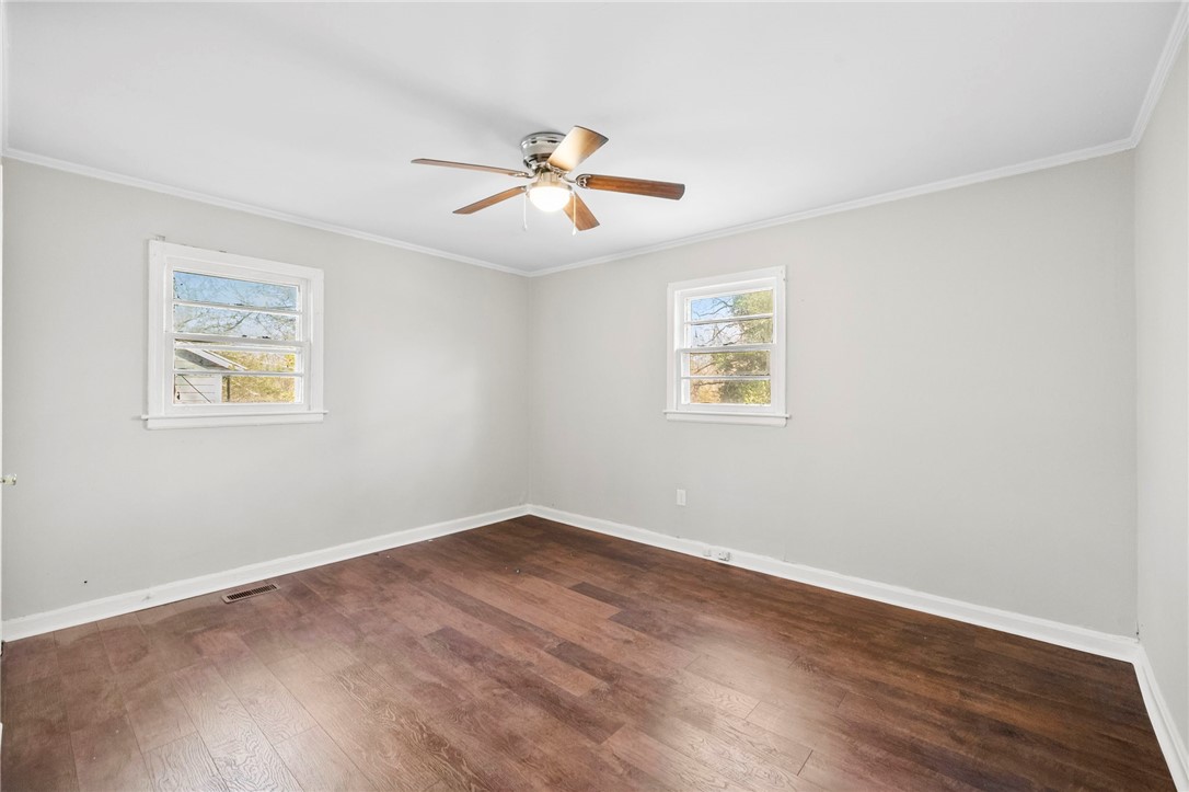 825 Dora Drive Anderson, SC 29624 - Photo 18 of 27 This spacious room features ample natural light and durable wood flooring.