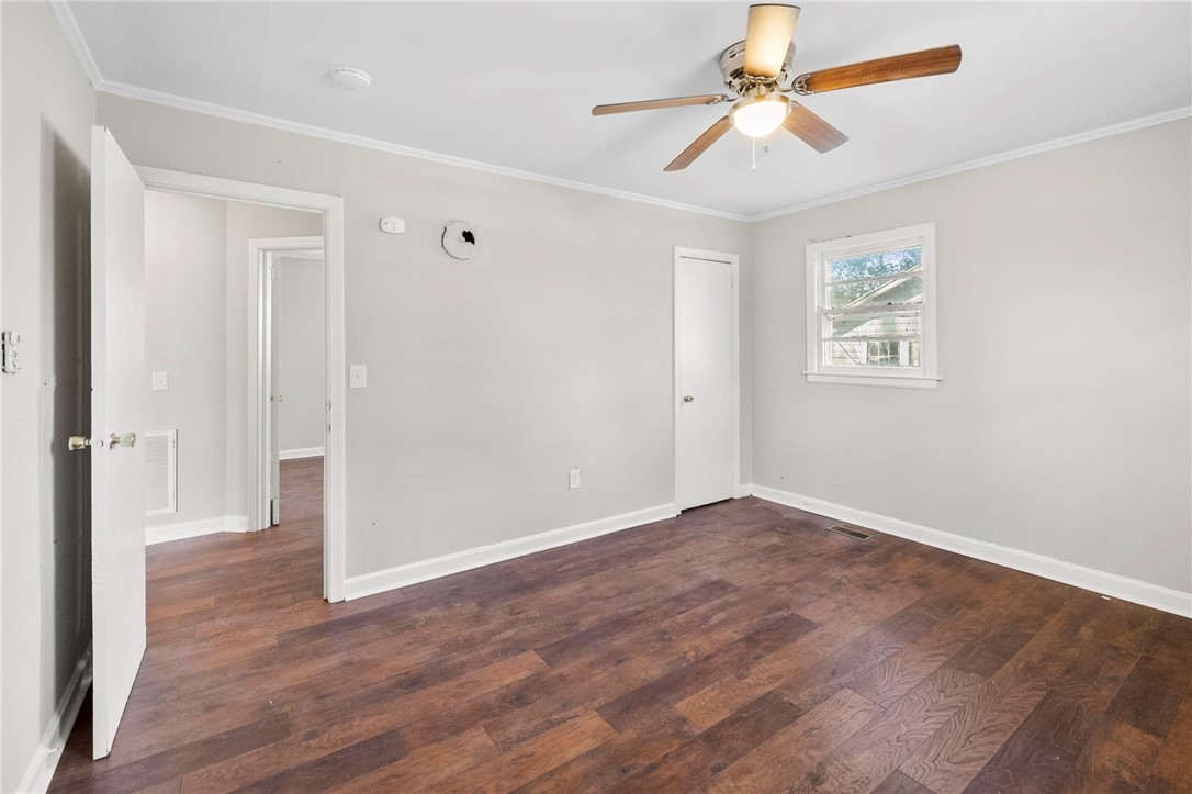 825 Dora Drive Anderson, SC 29624 - Photo 19 of 27 This versatile space features rich wood flooring and abundant natural light, creating an inviting atmosphere.