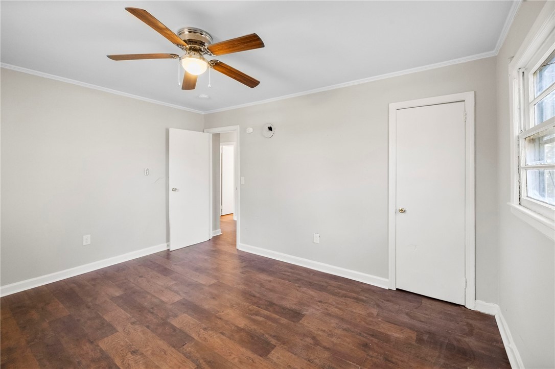 825 Dora Drive Anderson, SC 29624 - Photo 20 of 27 This airy room features rich hardwood flooring and a ceiling fan, offering comfort and style.