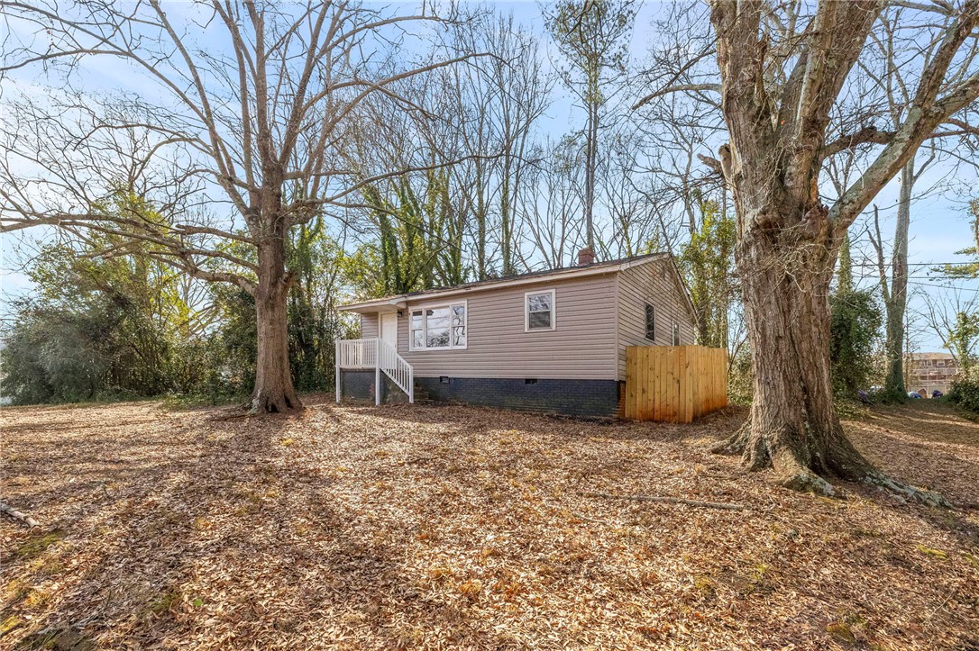 825 Dora Drive Anderson, SC 29624 - Photo 2 of 27 This cozy home offers a private yard and classic exterior finishes.