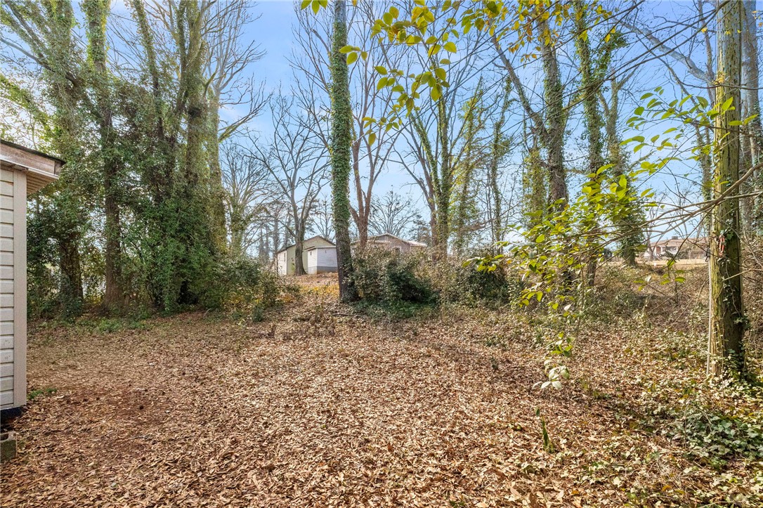 825 Dora Drive Anderson, SC 29624 - Photo 24 of 27 This lot offers a natural setting with mature trees and ample space.