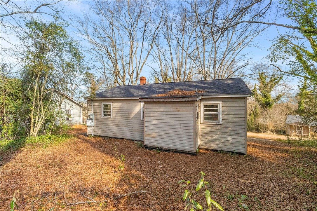 825 Dora Drive Anderson, SC 29624 - Photo 26 of 27 This charming home offers a serene escape, surrounded by nature and mature trees.