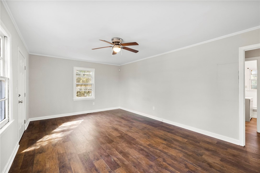 825 Dora Drive Anderson, SC 29624 - Photo 5 of 27 This airy room features rich hardwood flooring and a bright window, perfect for comfortable living.