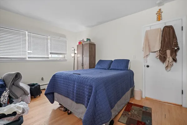 a bed room with a bed and a desk