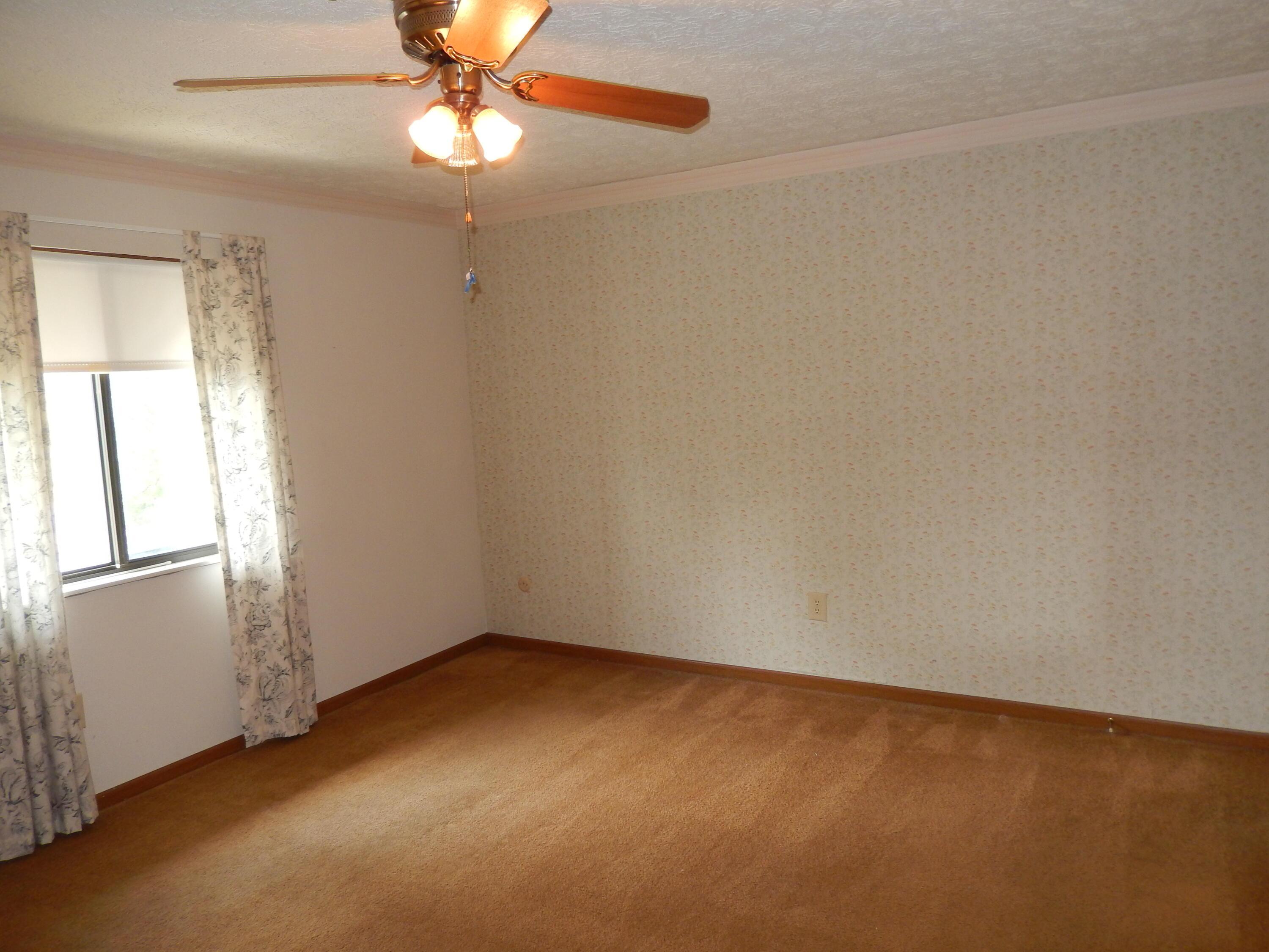4119 Karl Road, Unit 309 Columbus, OH 43224 - Photo 15 of 26 Owner's Bedroom with ceiling fan