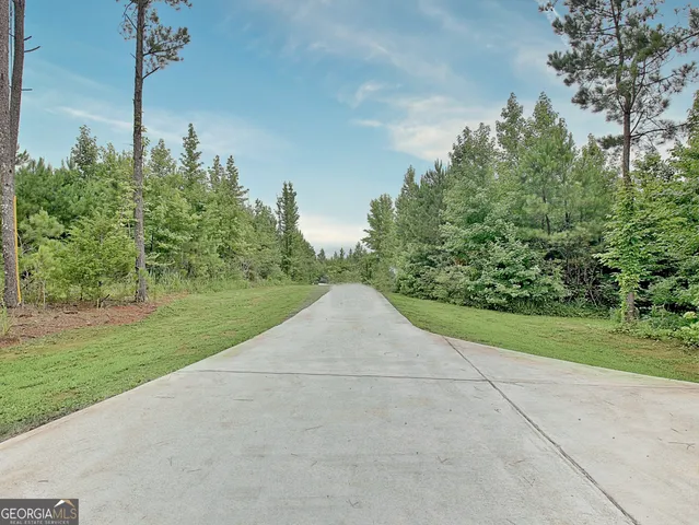 a view of a road with a yard