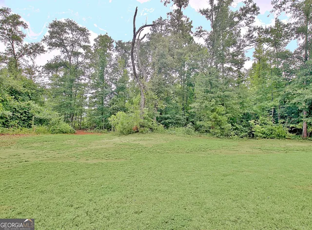 a view of a room with a backyard and a patio