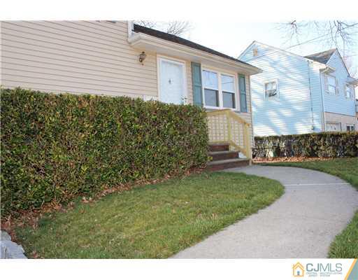 8 Wilshire Road Edison, NJ 08817 - Photo 11 of 25 a front view of a house with a garden