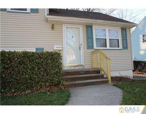 8 Wilshire Road Edison, NJ 08817 - Photo 12 of 25 a back view of a house with a yard
