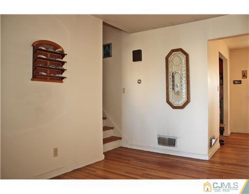 8 Wilshire Road Edison, NJ 08817 - Photo 13 of 25 a view of a livingroom with wooden floor