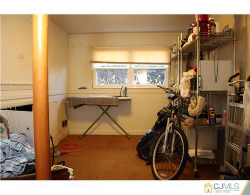 8 Wilshire Road Edison, NJ 08817 - Photo 17 of 25 a view of a room with gym equipment