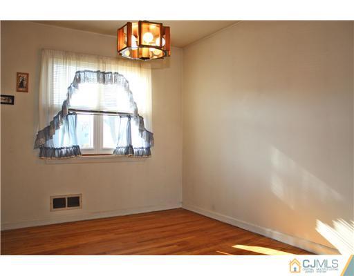 8 Wilshire Road Edison, NJ 08817 - Photo 3 of 25 a view of empty room with wooden floor