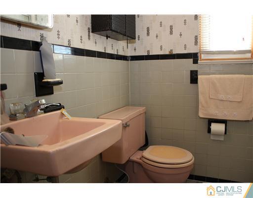 8 Wilshire Road Edison, NJ 08817 - Photo 6 of 25 a bathroom with a sink toilet and mirror