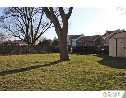 8 Wilshire Road Edison, NJ 08817 - Photo 8 of 25 a view of a yard with an house