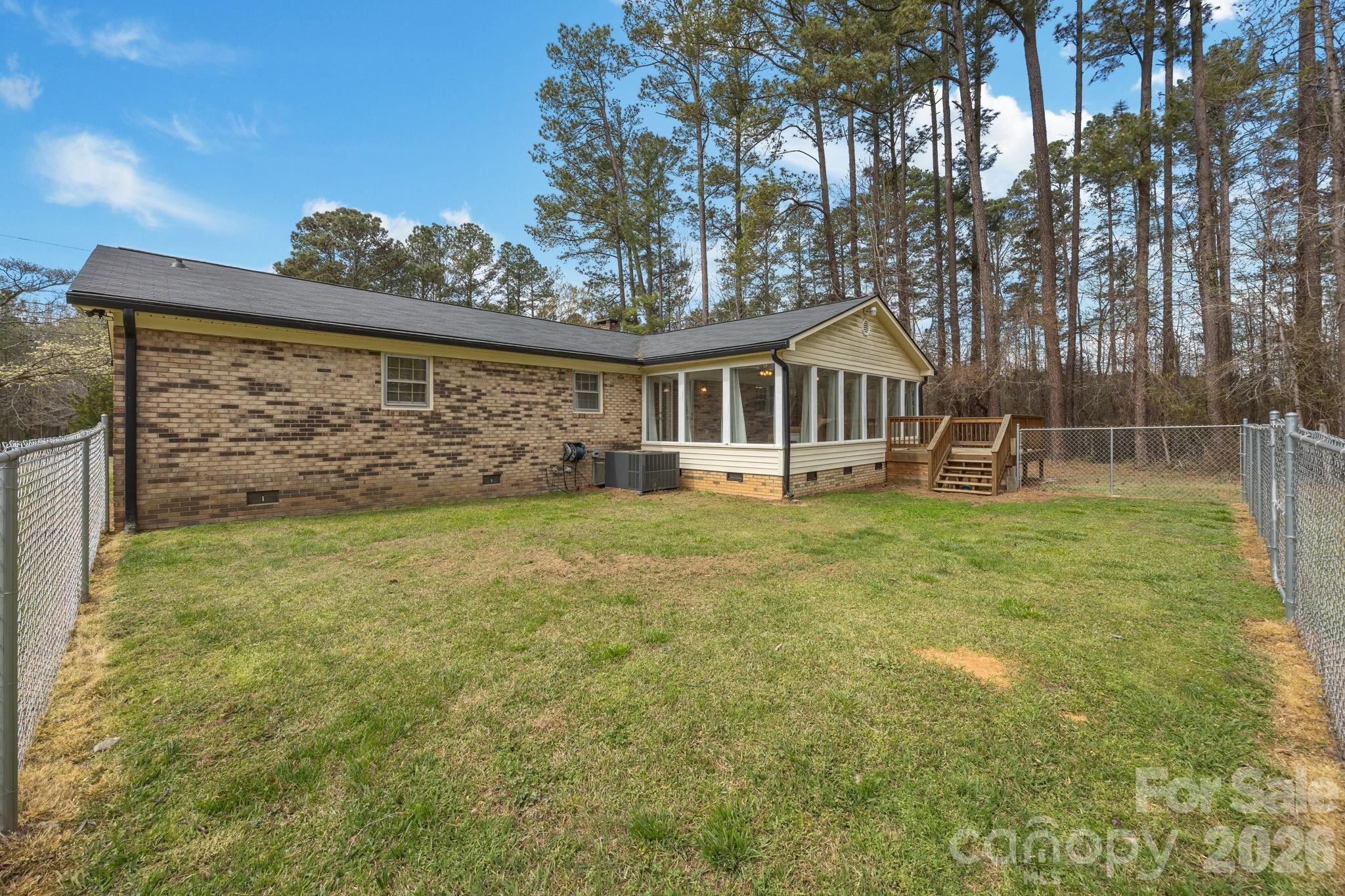 9698 Pine Tree Road, Unit 55 Norwood, NC 28128 - Photo 27 of 29 front view of a house with a yard