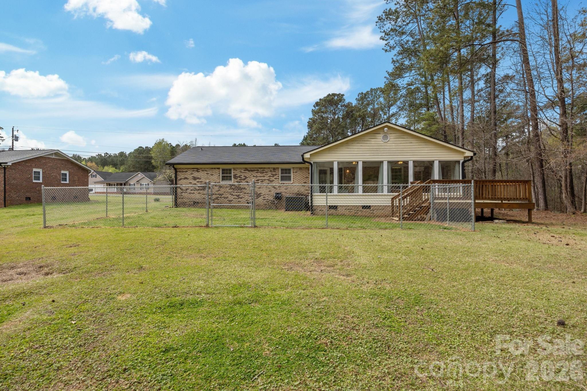 9698 Pine Tree Road, Unit 55 Norwood, NC 28128 - Photo 28 of 29 a front view of a house with garden