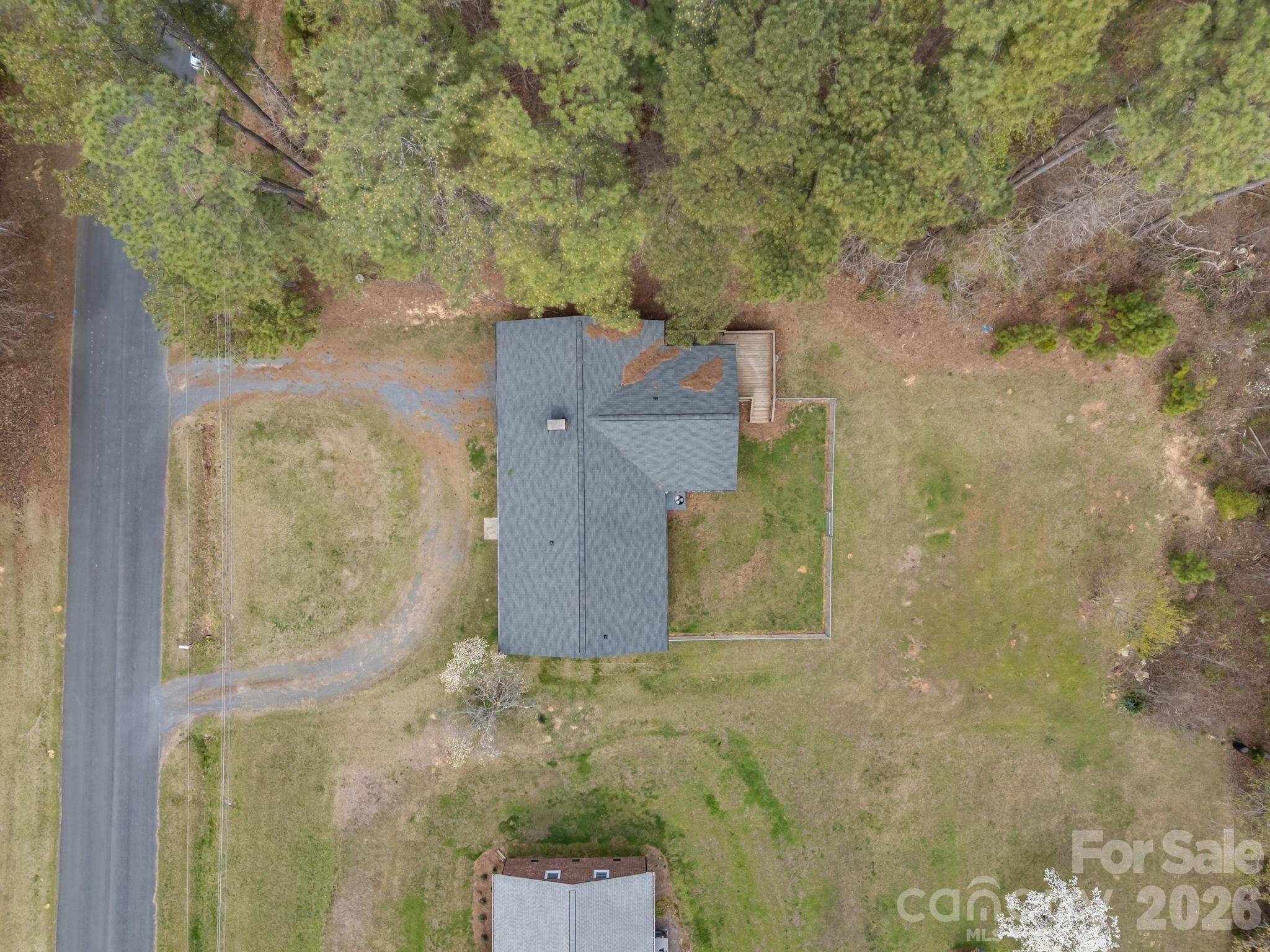 9698 Pine Tree Road, Unit 55 Norwood, NC 28128 - Photo 5 of 29 an aerial view of a house with a yard