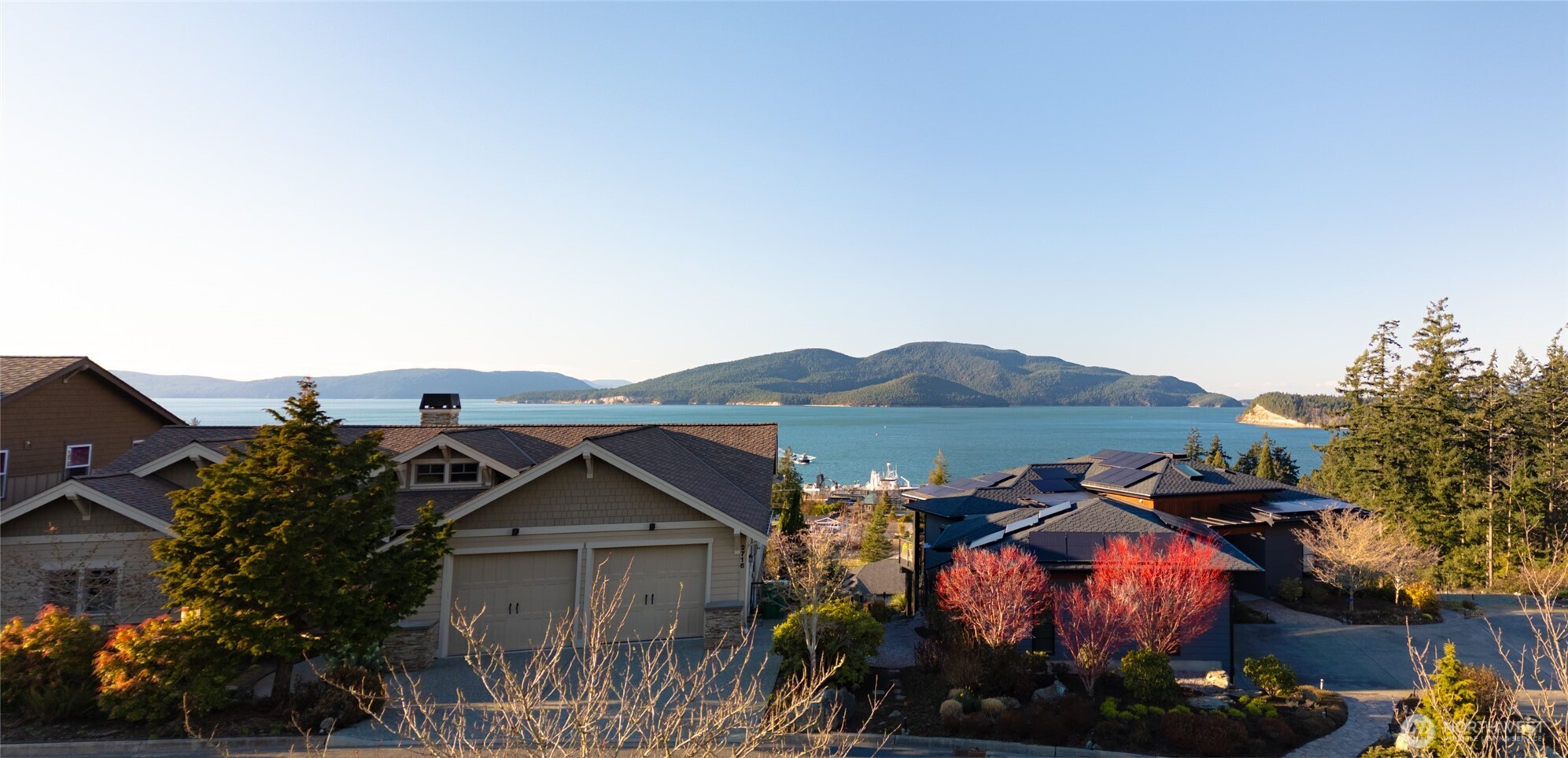 2707 17th Street Anacortes, WA 98221 - Photo 2 of 10 a view of a house with a yard and table and chairs under an umbrella