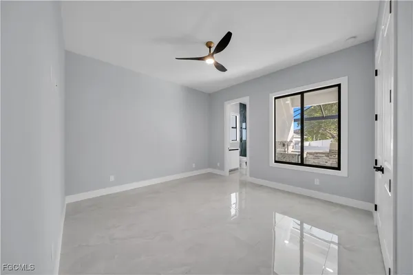 a view of an empty room with a window