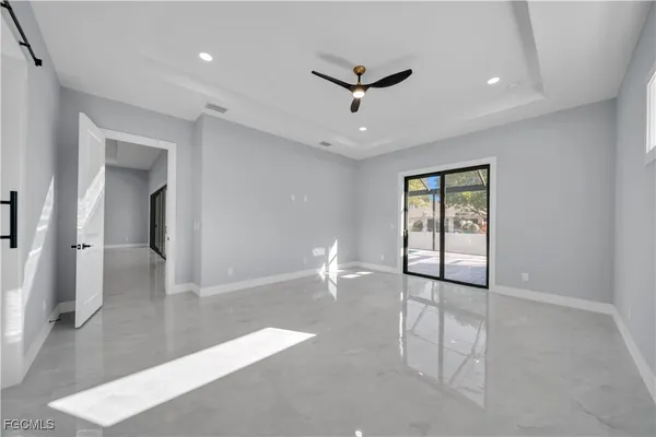 a view of an empty room with a window