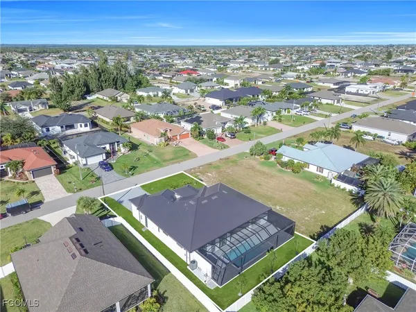 an aerial view of houses with outdoor space