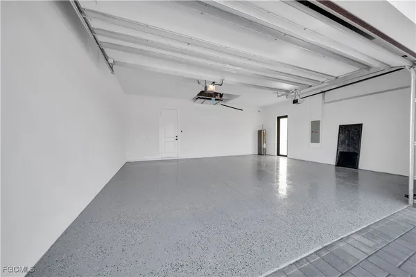 wooden floor in an empty room with a ceiling fan