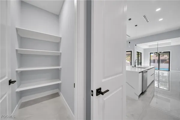 a view of a hallway with closet