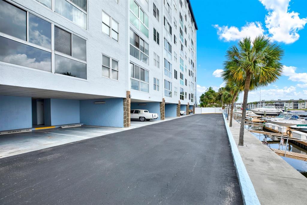 4939 Floramar Terrace, Unit 204 New Port Richey, FL 34652 - Photo 4 of 22 a view of a building with a road