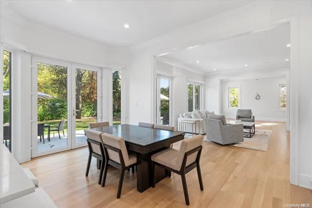 a dining room with furniture and wooden floor
