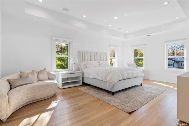 a bedroom with a bed and a couch