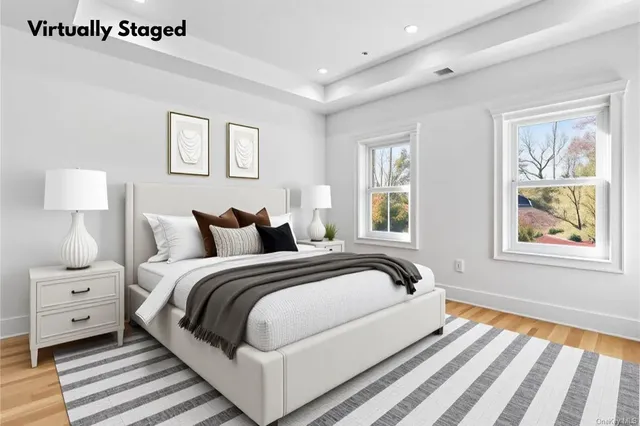 a bedroom with bed and a window