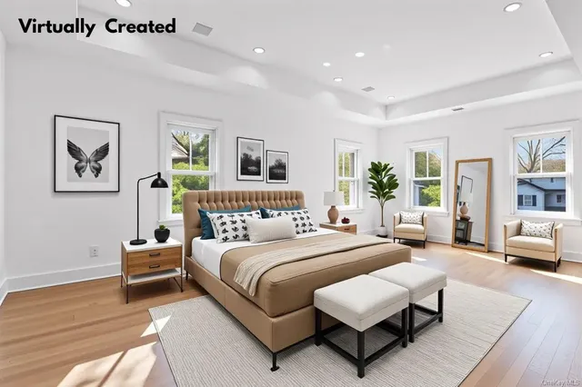 a bedroom with a bed couch and a window