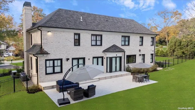 a front view of a house with garden and porch