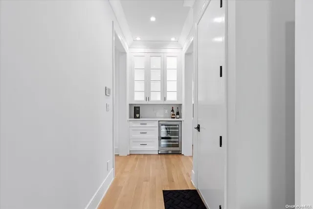 wooden floor in an empty room and a window