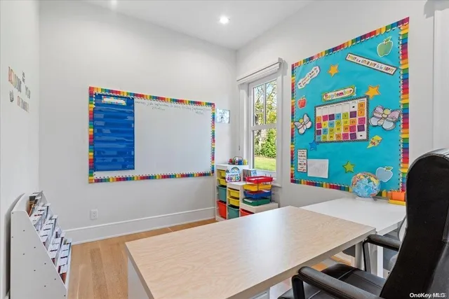 a view of a dining room with furniture and a window