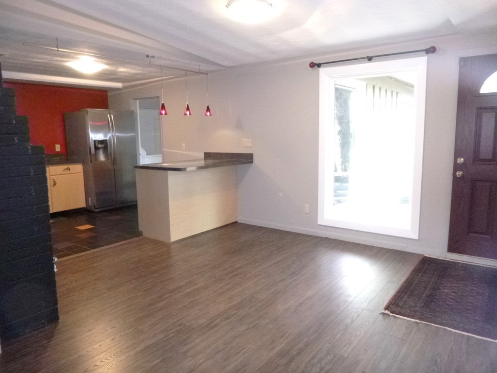 4 Clara Road Framingham, MA 01701 - Photo 9 of 21 a view of kitchen with wooden floor and electronic appliances