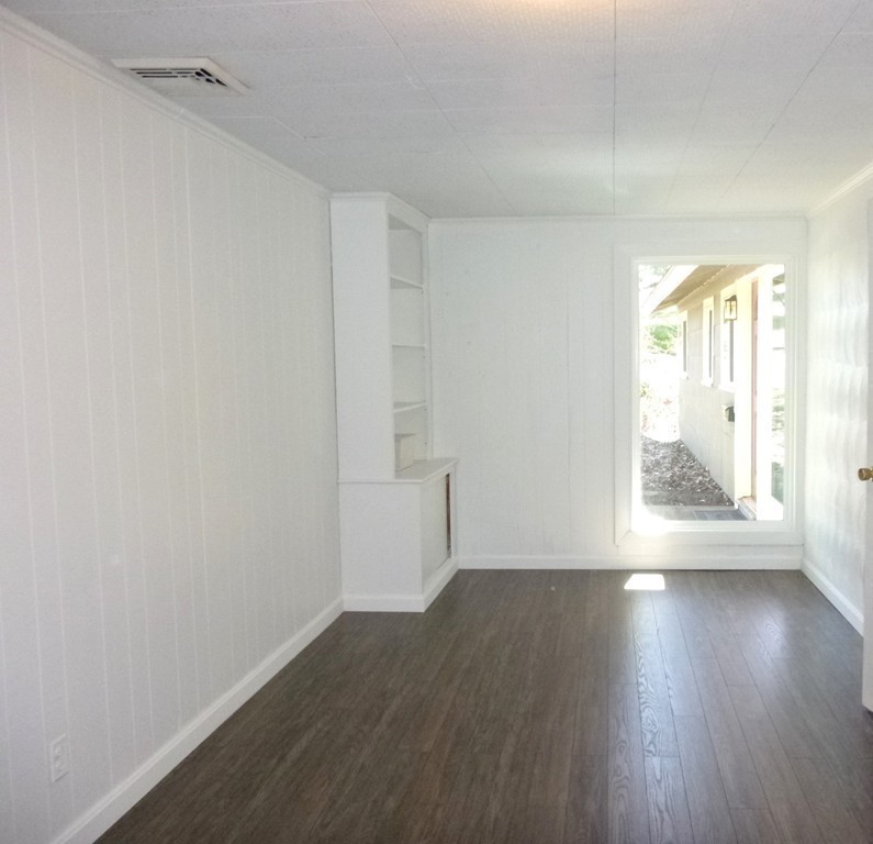 4 Clara Road Framingham, MA 01701 - Photo 10 of 21 a view of wooden floor and windows in a room