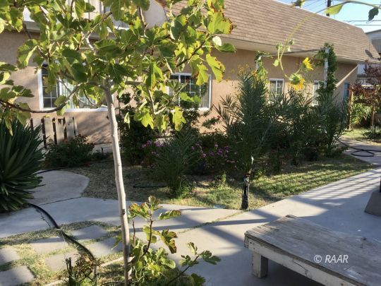 828 North Balsam Street Ridgecrest, CA 93555 - Photo 30 of 32 a view of a yard with plants