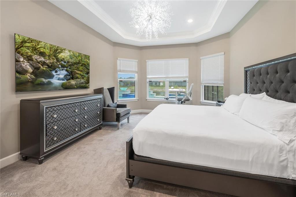 8416 Rosa Court Naples, FL 34114 - Photo 15 of 33 a bed sitting in a spacious bedroom next to a window