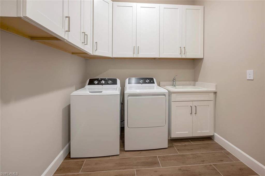 8416 Rosa Court Naples, FL 34114 - Photo 20 of 33 a utility room with dryer and washer